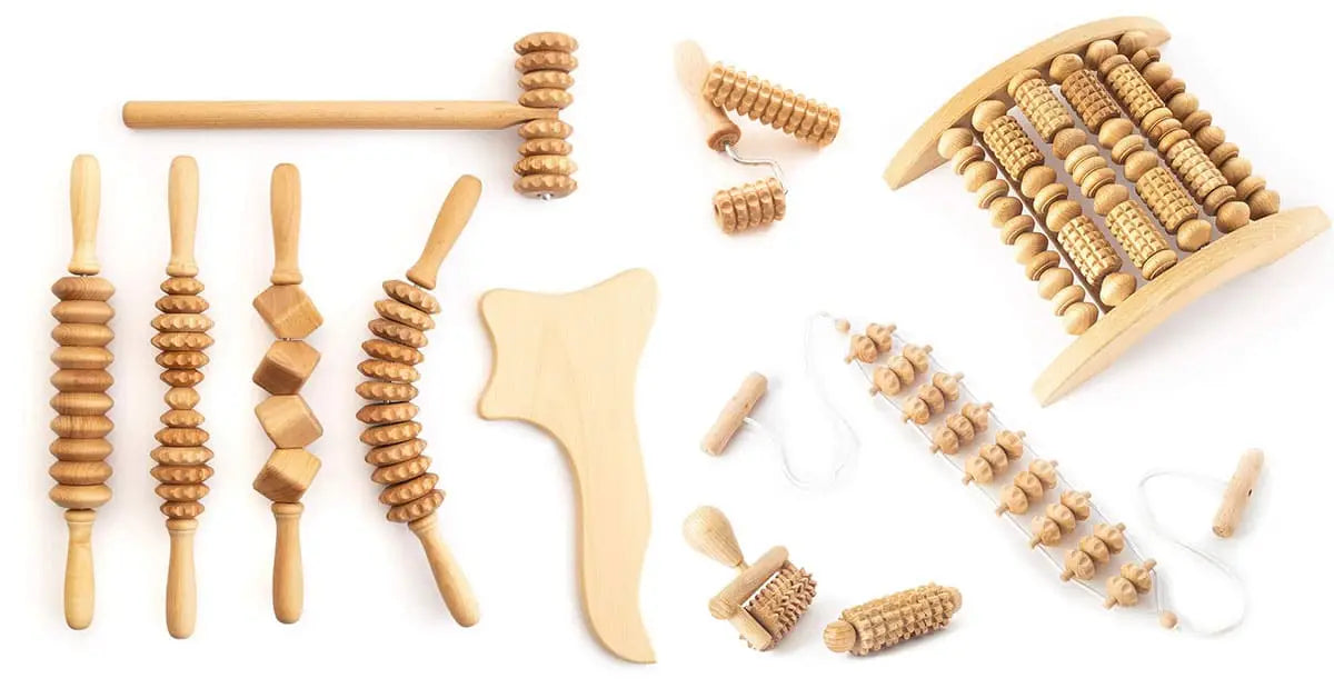 showing wooden massager sticks, face massagers and foot massager on white background