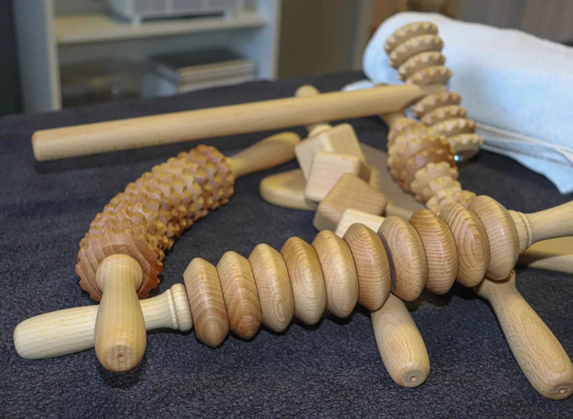 Lifestyle scene: wooden massagers on bed