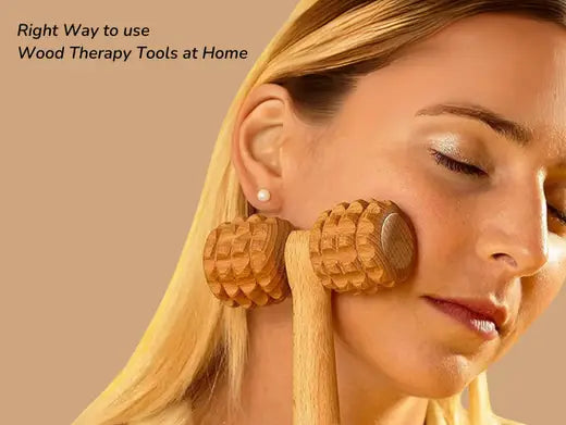 Girl using wooden massager for relaxing on her face