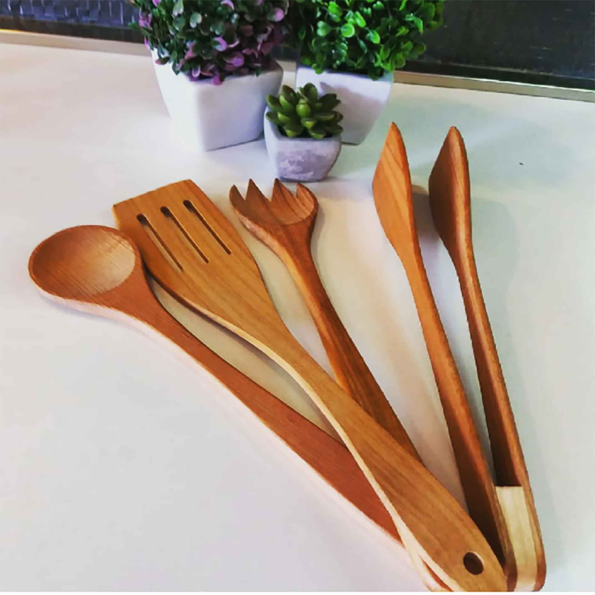 Wooden kitchen utensils arranged for everyday cooking