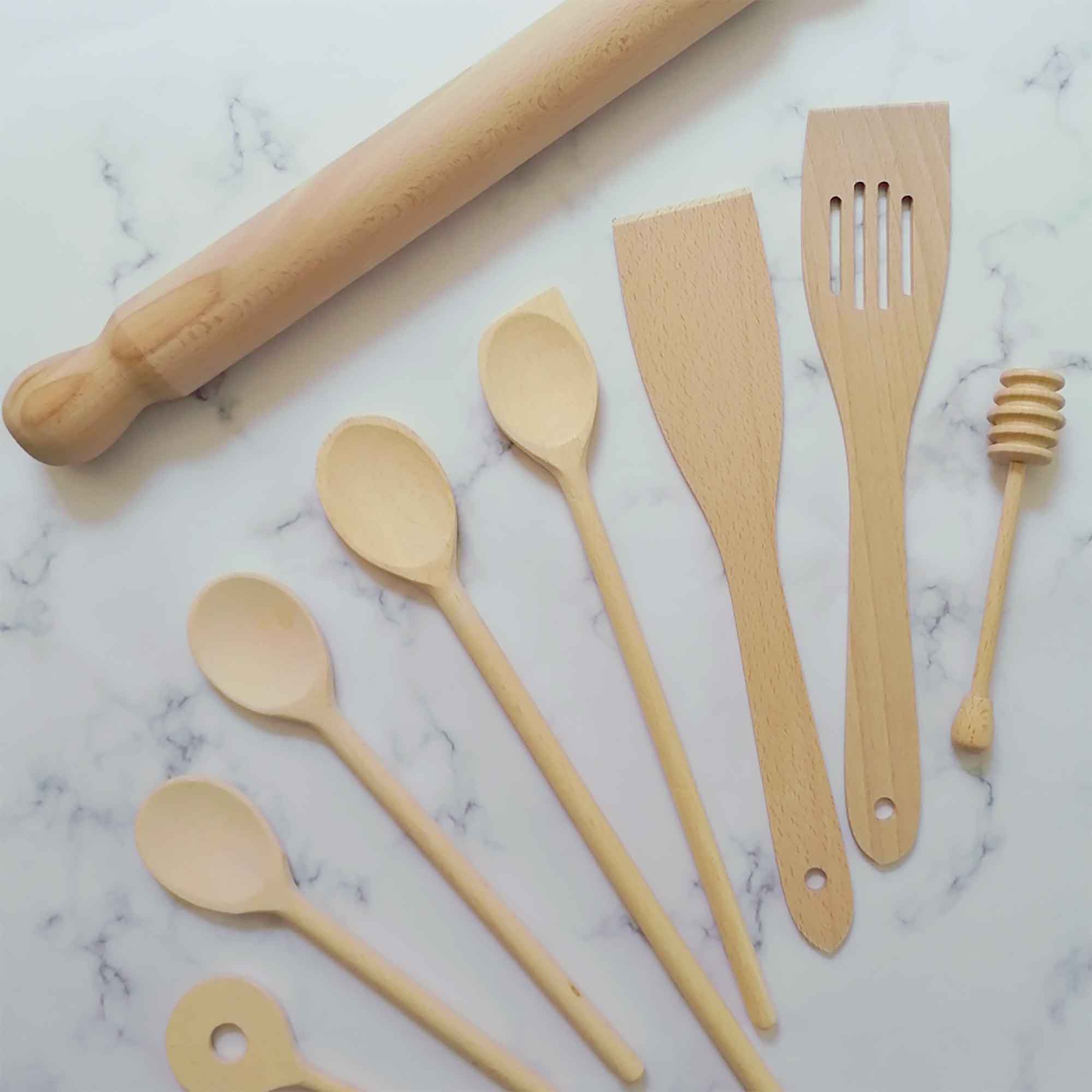 Wooden kitchenware and utensils arranged for everyday cooking