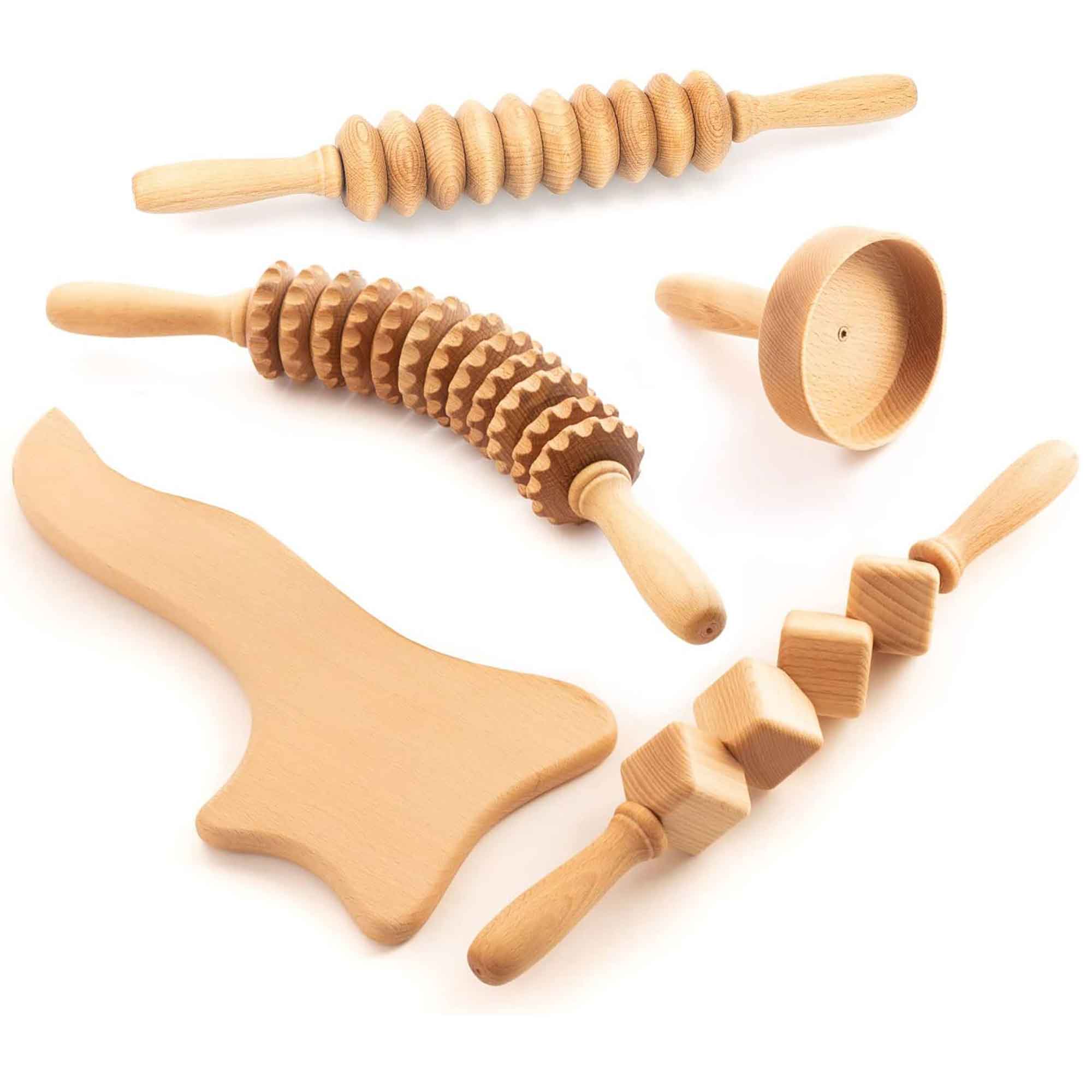 Set of wooden massage rollers and massage tools on a white background