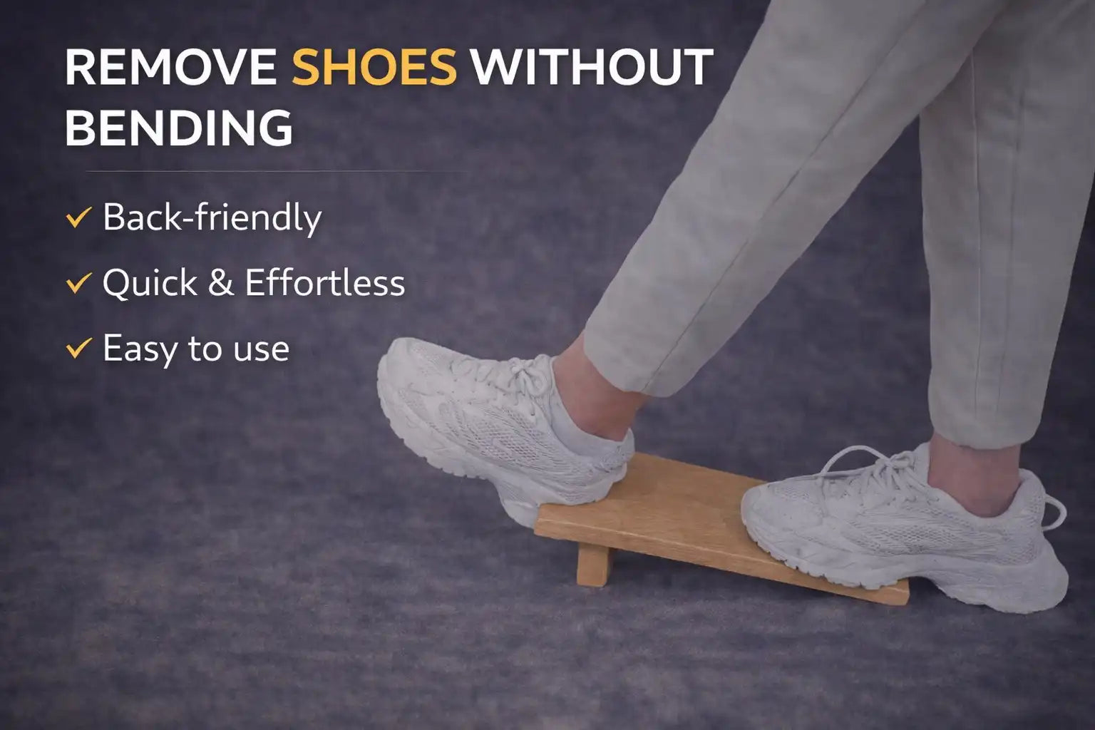 Person using beechwood boot jack to remove a white shoe