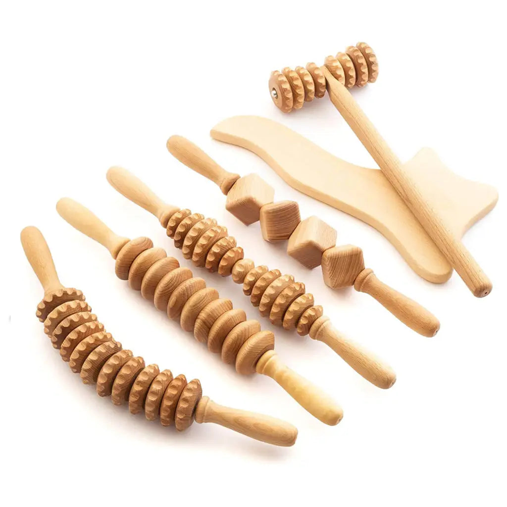 6-piece beechwood massager set with 4 rollers, T-massager and paddle on neutral background