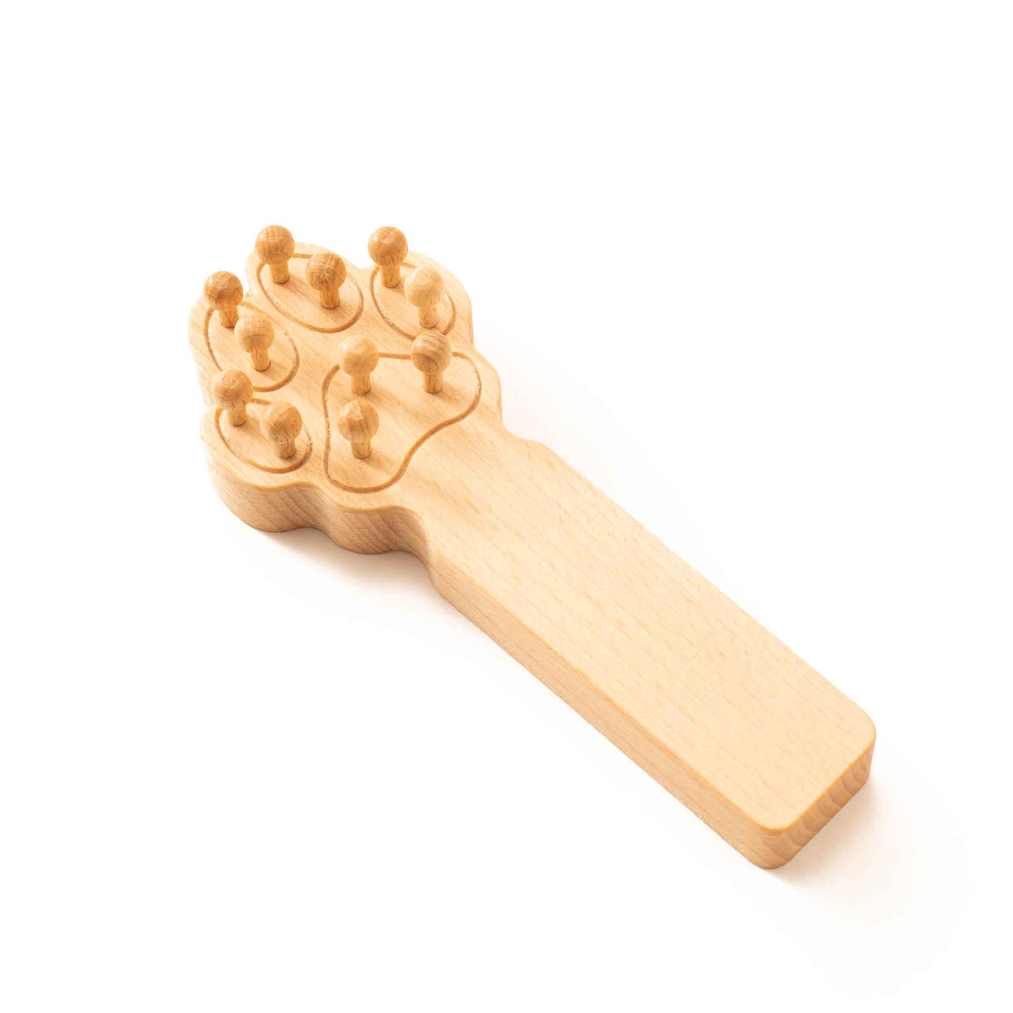 Wooden pet massager shown for supervised grooming and gentle care