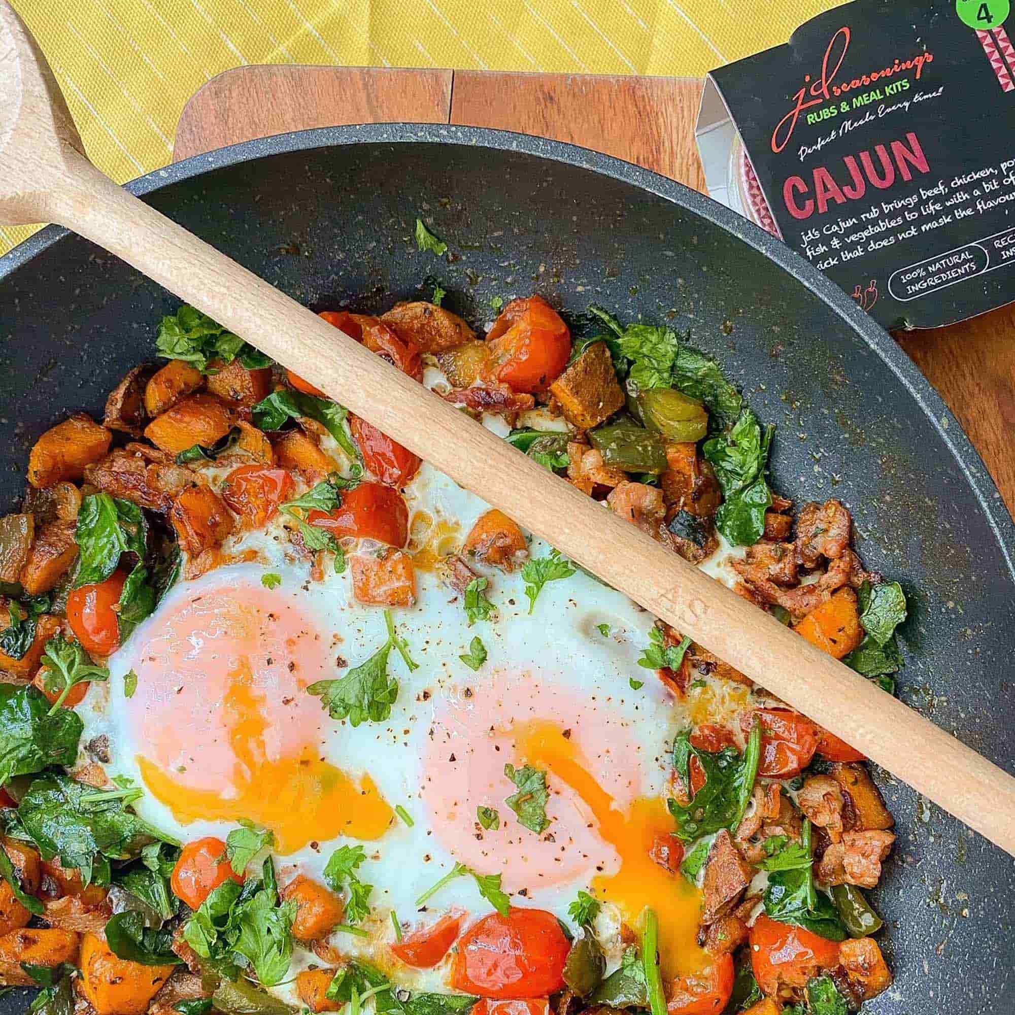 Wooden spoon resting over a hot pan during everyday cooking