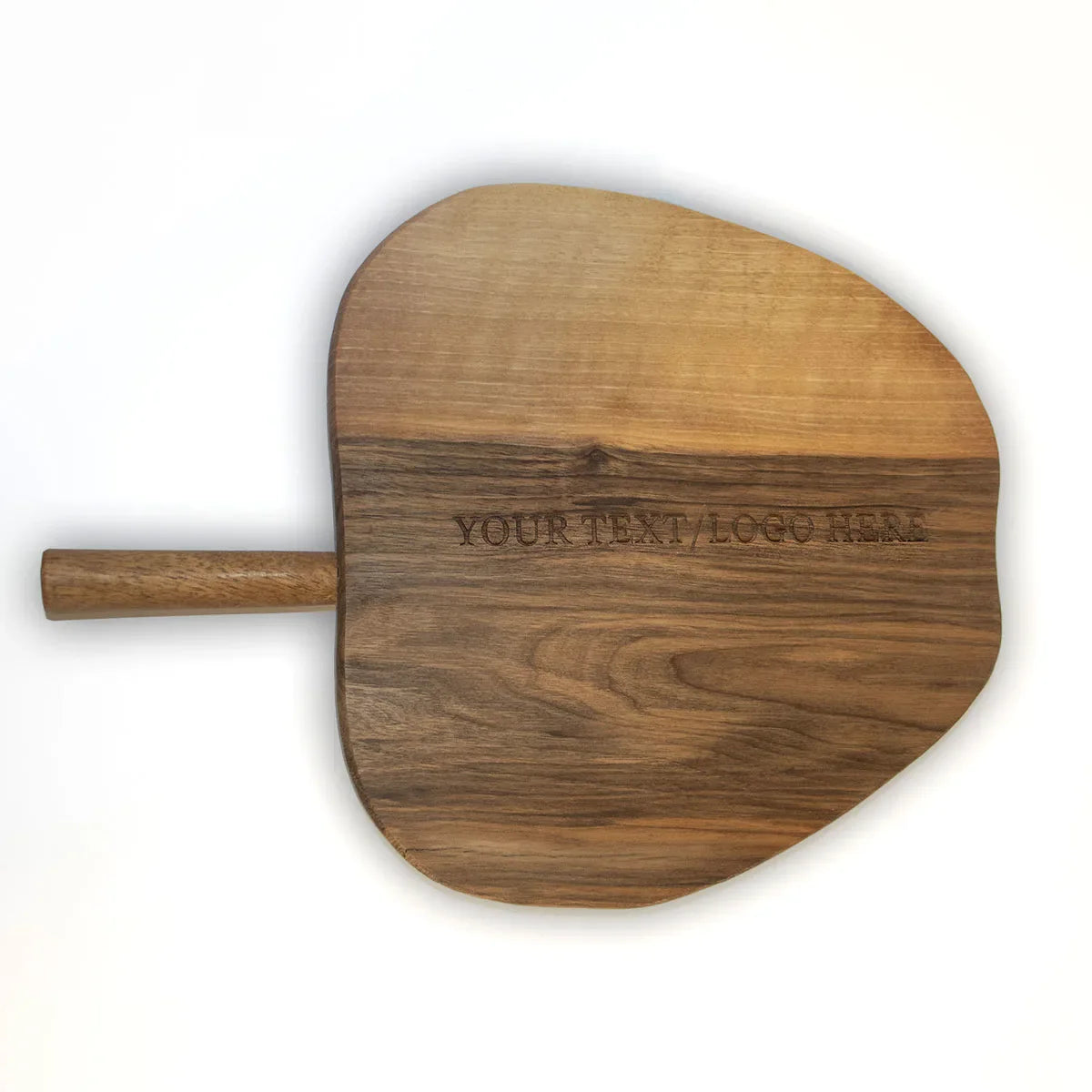 Personalized walnut cutting board being used to chop fresh vegetables in modern kitchen