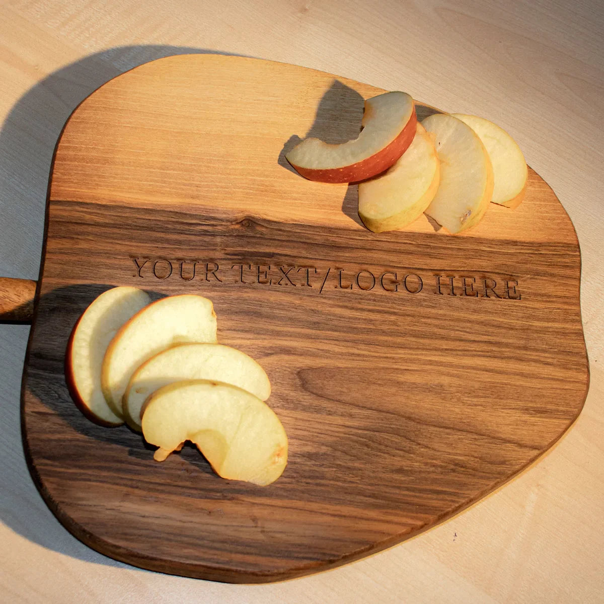 Comparison of walnut cutting board with maple cutting boards showing rich color contrast