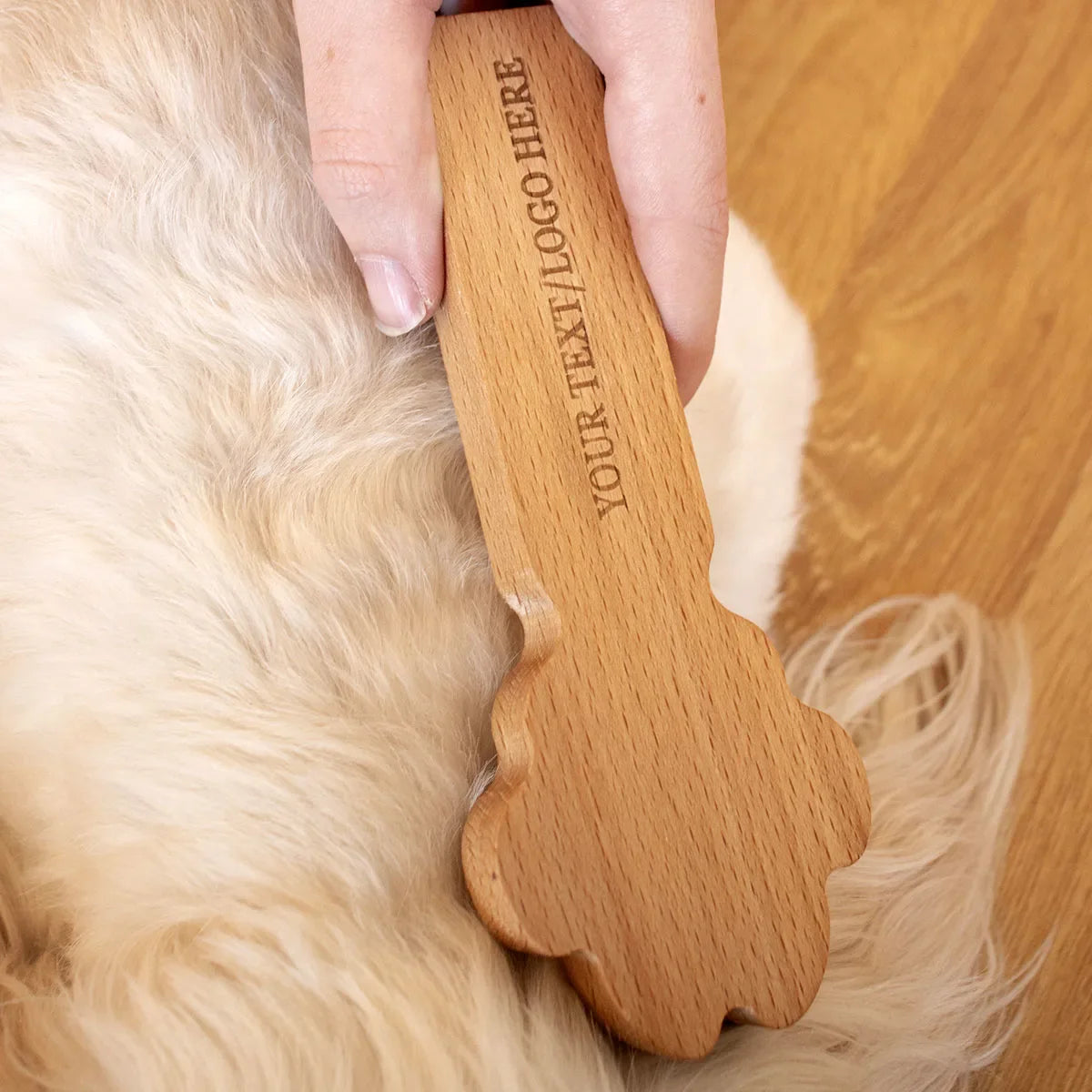 Eco-friendly wooden pet massage tool showing natural grain texture