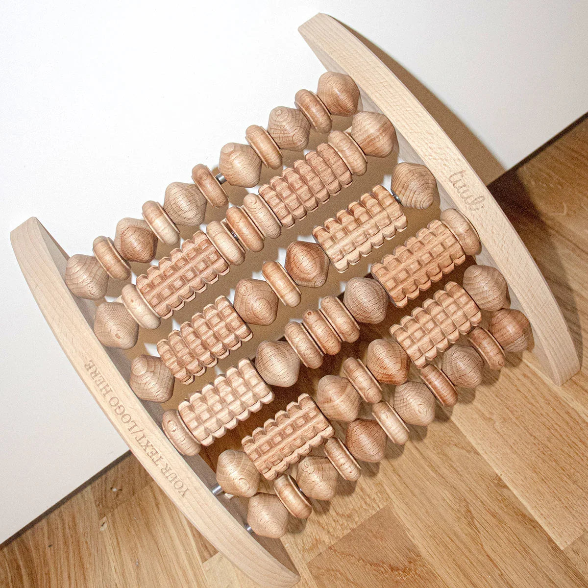 Lifestyle Image: Wooden Foot Massager in Minimalist Home Wellness Setting with Natural Lighting