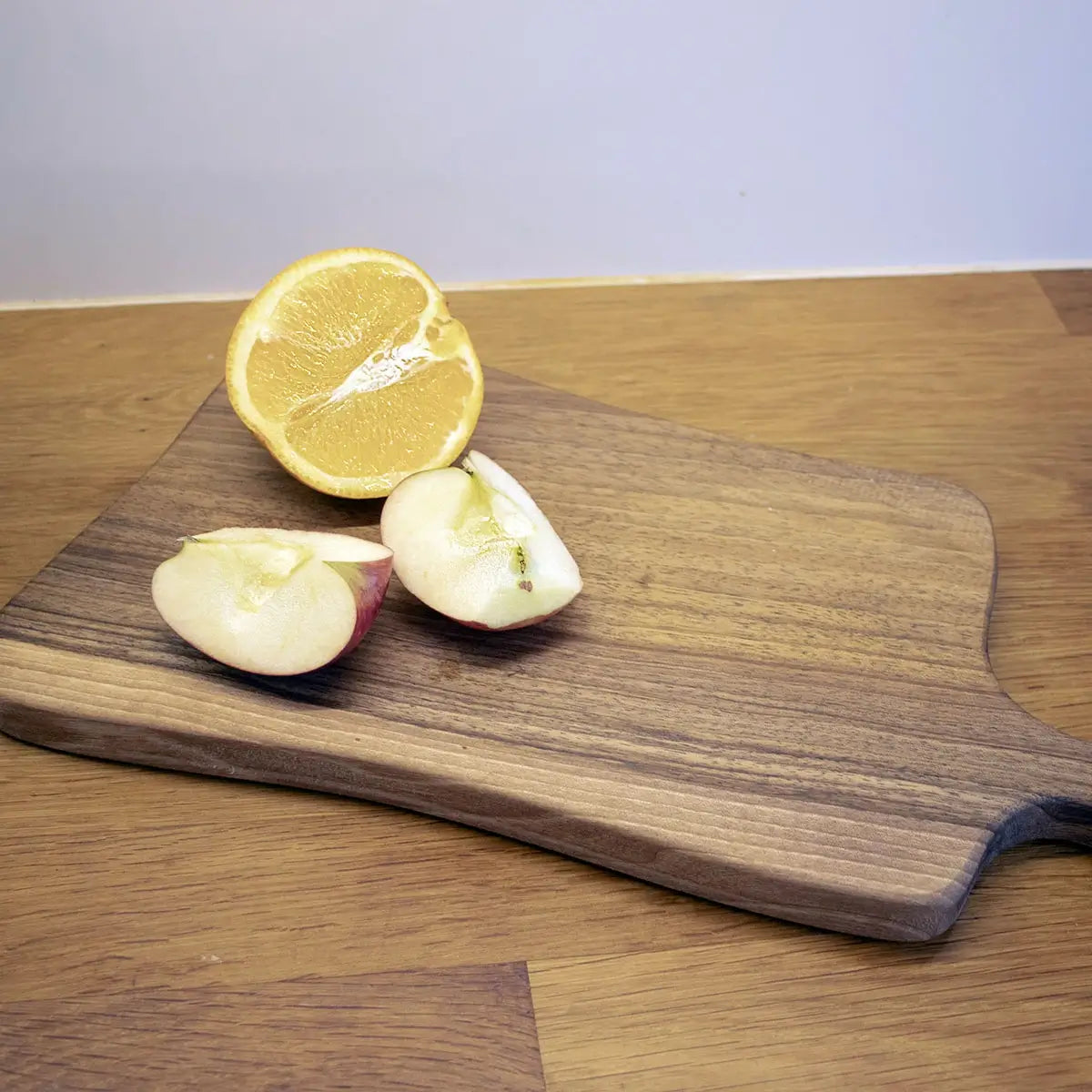 Professional chef using Tuuli Shop Walnut Wood Cutting Board for food preparation