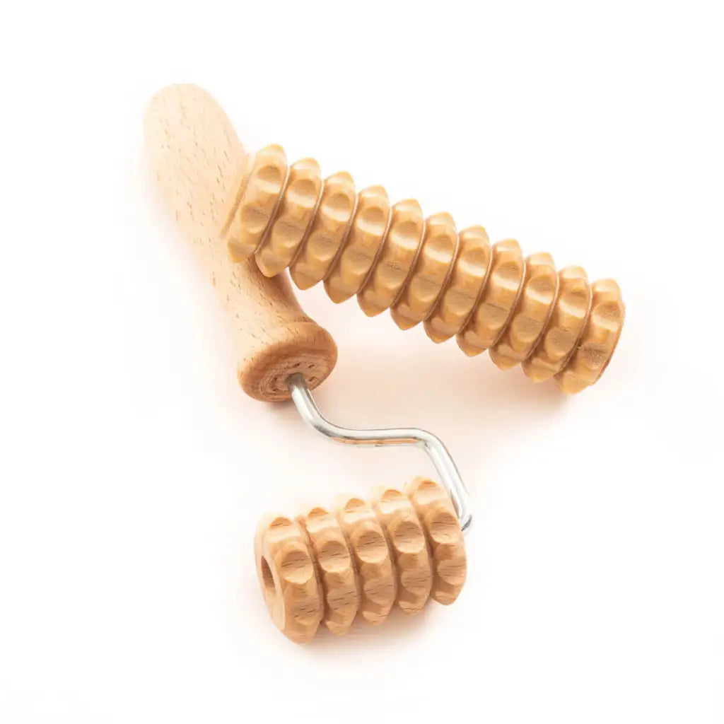 Two natural-wood mini derma rollers (18×4 cm and 11×3 cm) on neutral background