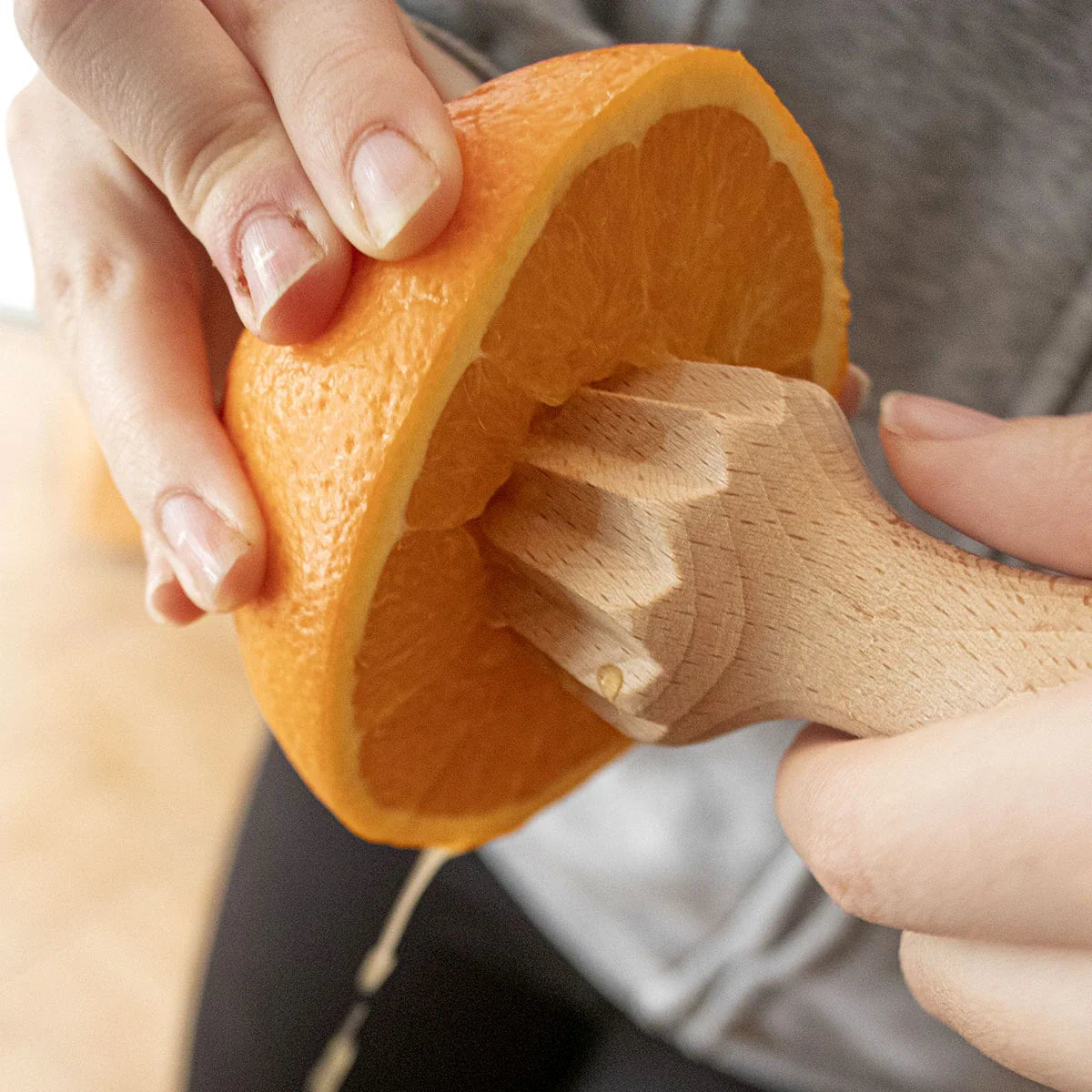 Lifestyle Image of Handcrafted Wood Grinder in Action - Grinding Fresh Walnuts for Gourmet Recipes